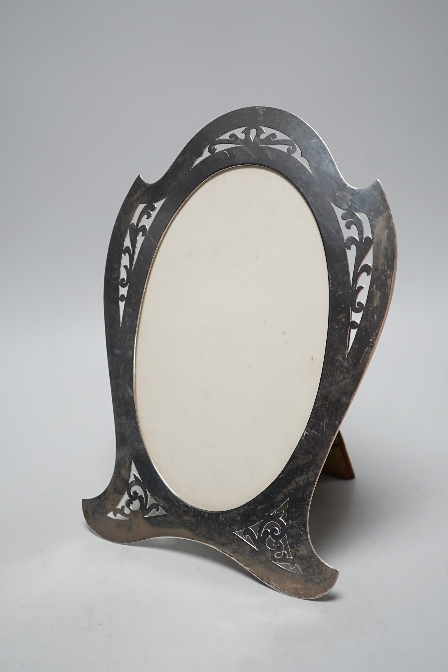 A stylish Edwardian pierced silver mounted photograph frame, Lawrence Emanuel, Birmingham, 1909, 27cm.